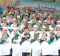 بالجلباب الأبيض والمصحف.. تكريم حفظة القرآن الكريم بمدارس 30 يونيو بأسيوط